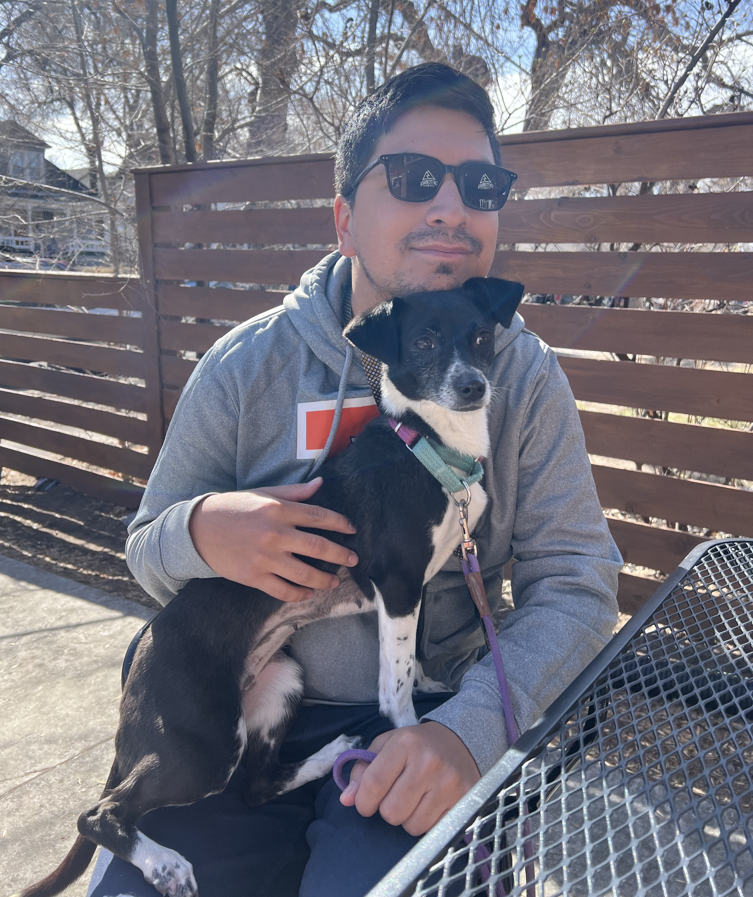 Dylan Sanchez holding a dog. 