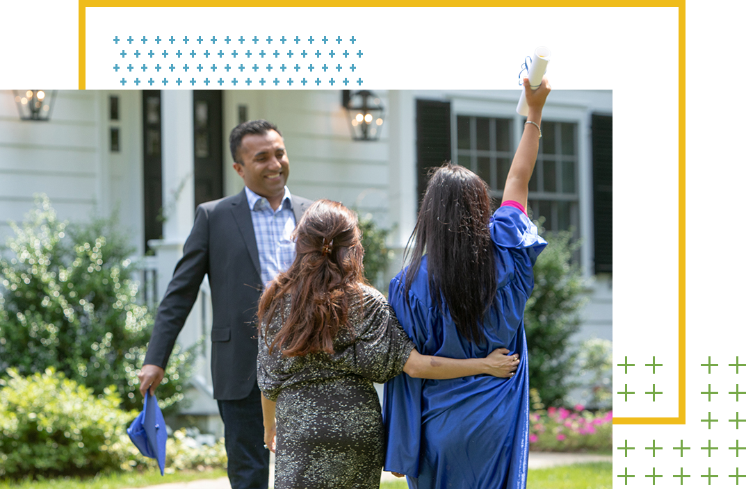 Graduate celebrating with father and siste